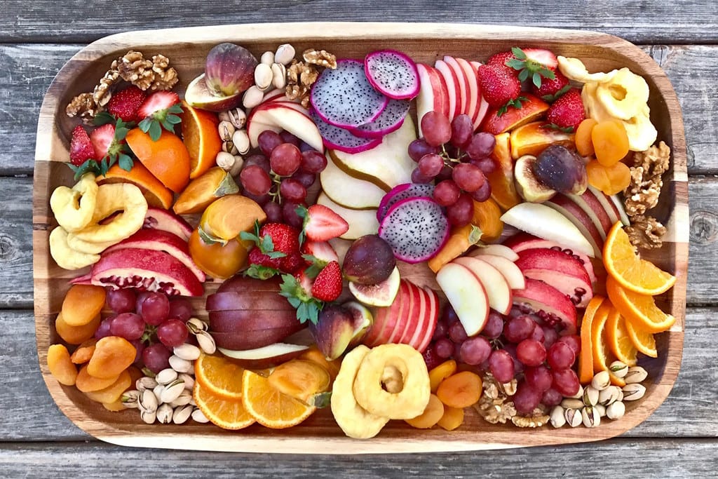 Vareity of sliced fruit on a tray